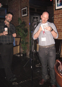 ARCS volunteer Christopher Emerson assists ARCS' Director of Public Relations, J. Dewey, with handing out raffle prizes to winners.