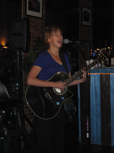 Musician Judith Tulloch on guitar. Judith performs again at Chill with her complete band on August 28, 2010.