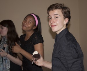 The cast of "Rent" takes a break to enjoy cupcakes from Lulu Cake Boutique.