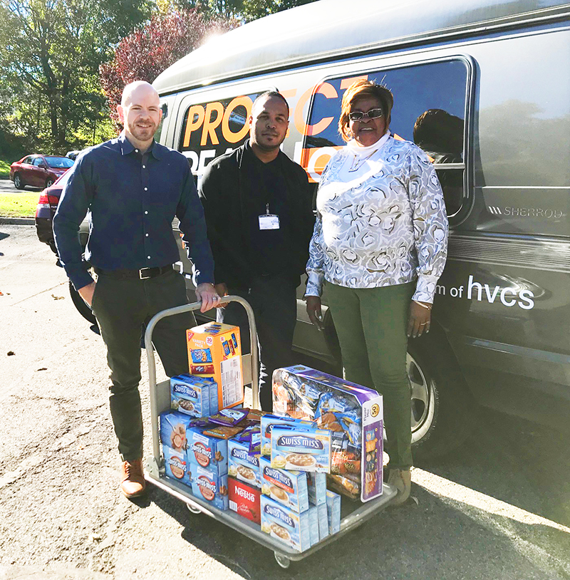 Members of HVCS' staff with the donation