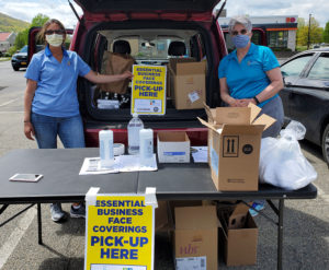 DCRCOC members distributing face masks to essential businesses