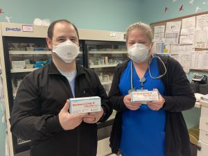 CFH staff with boxes of the Moderna COVID-19 vaccine.